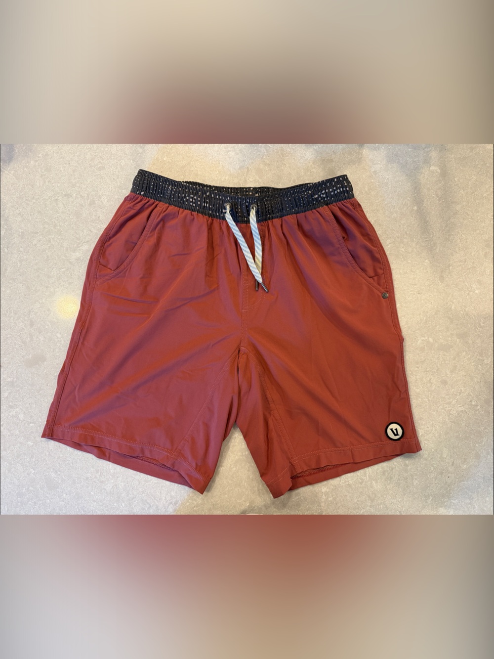 Vuori Men's Athletic Shorts in Rust Red with Black Waistband with Lining
